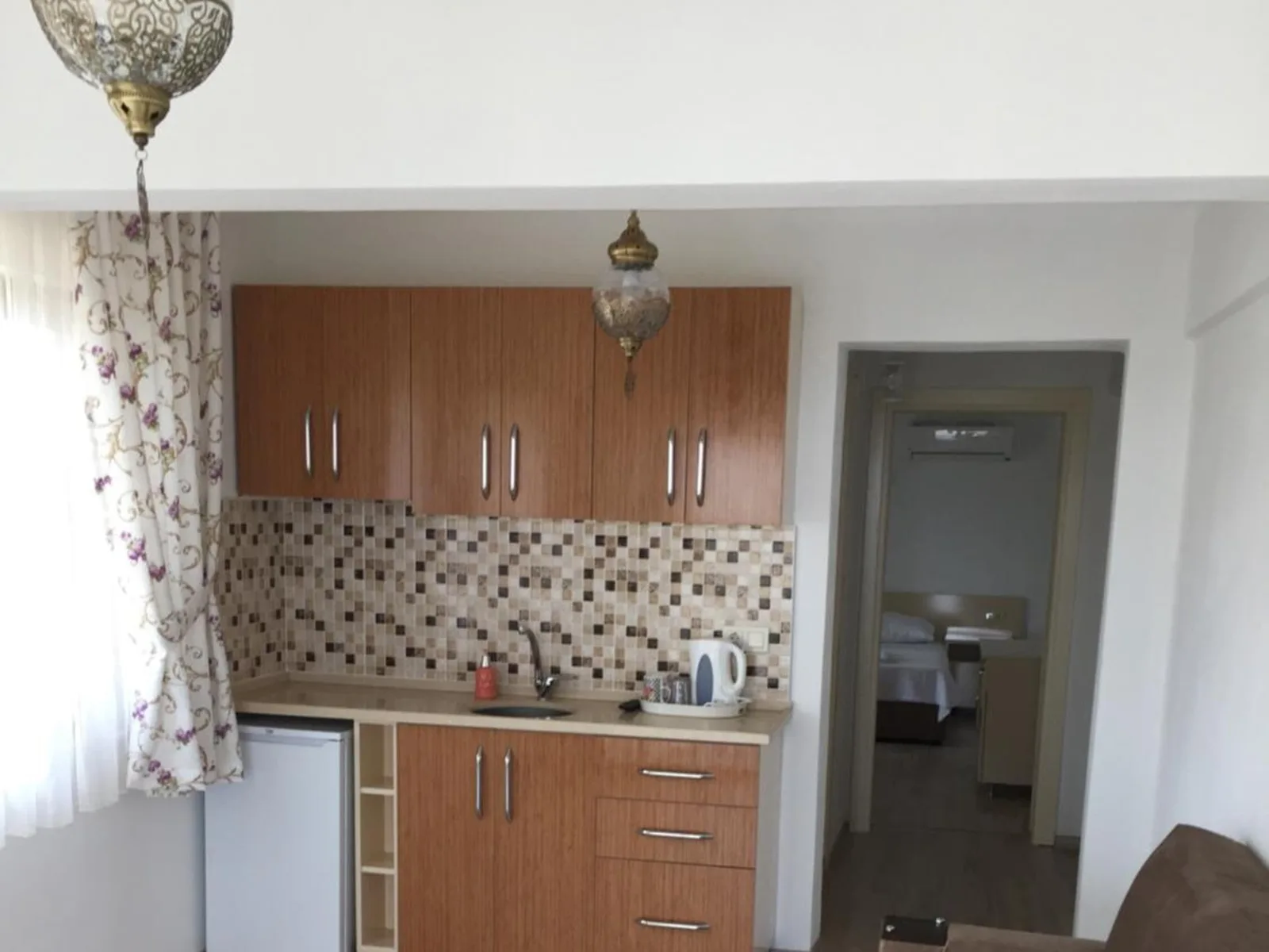 The suite's kitchenette: fitted units, fridge and kettle
